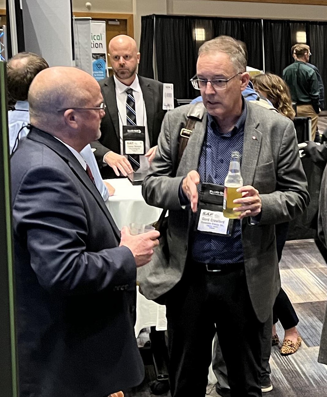 MFI Executive Rick Horton (left) discusses woody biomass with Gord Crawford, President &CEO of Expander Energy, Inc.